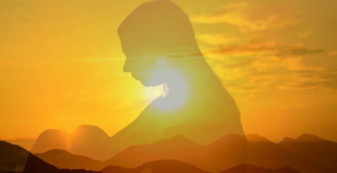 Woman silhouette in sunset