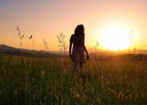 Girl in Field Sunset