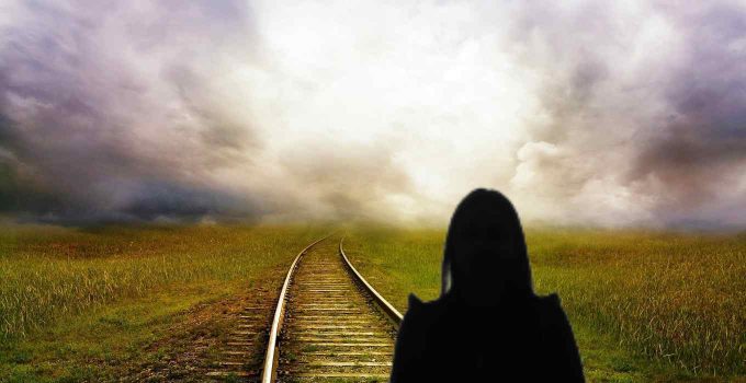 Girl Facing Railroad Tracks