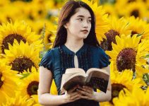 Girl in field of sunflowers