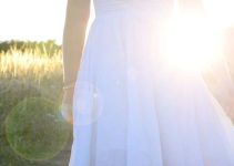 Little Girl in White Dress Facing Light